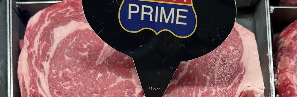 Ribeyes graded as "prime" in the grocery butcher case. Taken May 3, 2025. (U of A System Division of Agriculture photo.)
