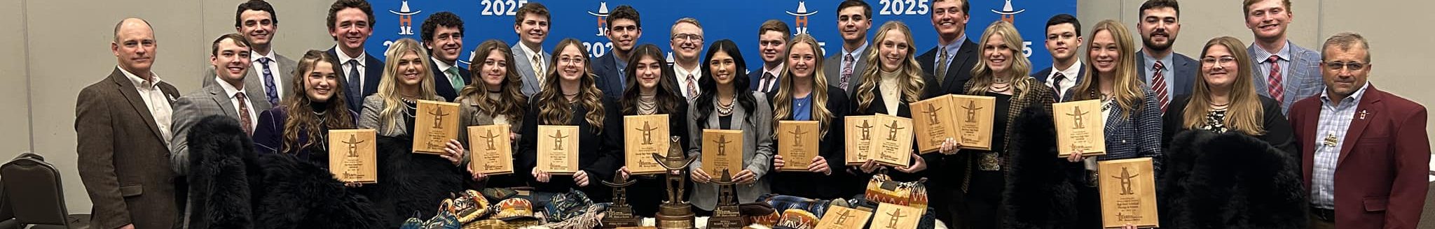 The winning Texas A&M Wool Judging Teams display their plaques and the other prizes they collected for winning both grand and reserve at the Intercollegiate National Wool Judging competition at the Houston Livestock Show and Rodeo. (Shawn Ramsey/Texas A&M AgriLife)