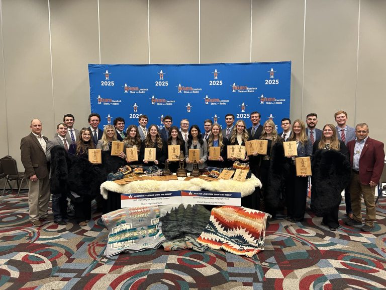 The winning Texas A&M Wool Judging Teams display their plaques and the other prizes they collected for winning both grand and reserve at the Intercollegiate National Wool Judging competition at the Houston Livestock Show and Rodeo. (Shawn Ramsey/Texas A&M AgriLife)