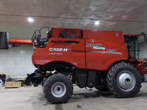A combine getting a fresh lettering job.