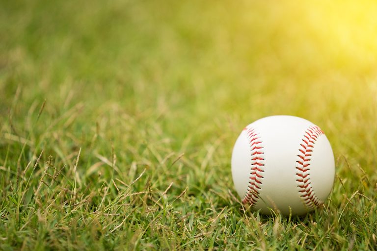 Close-up baseball on the infield. (Adobe Stock │ #128556727 - tatomm)