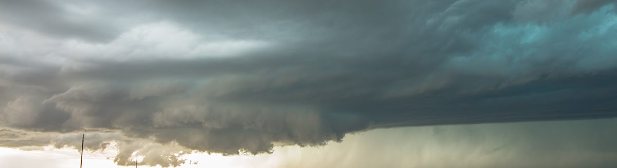A wall cloud forms underneath a tornadic supercell thunderstorm as it gathers strength. (Adobe Stock │ #157359268 - Dan Ross)