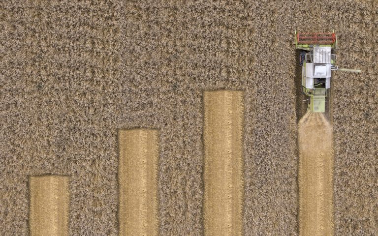 Combine harvester chart. Rising chart on field. (iStock │ #639390306 - rkankaro)