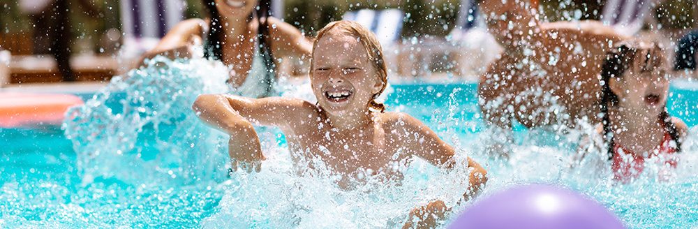 Parents and children laughing while playing ball in swimming pool. Smart farming and digital agriculture. (Adobe Stock │ #279305778 - Viacheslav Yakobchuk)