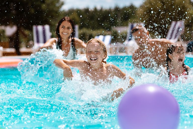 Parents and children laughing while playing ball in swimming pool. Smart farming and digital agriculture. (Adobe Stock │ #279305778 - Viacheslav Yakobchuk)