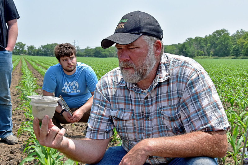 NRCS Soil Scientist Jason Steele measures water infiltration during Soil Health and Sustainability on June 10, 2025, near Ainsworth, IA. ( Jason Johnson - Iowa NRCS)