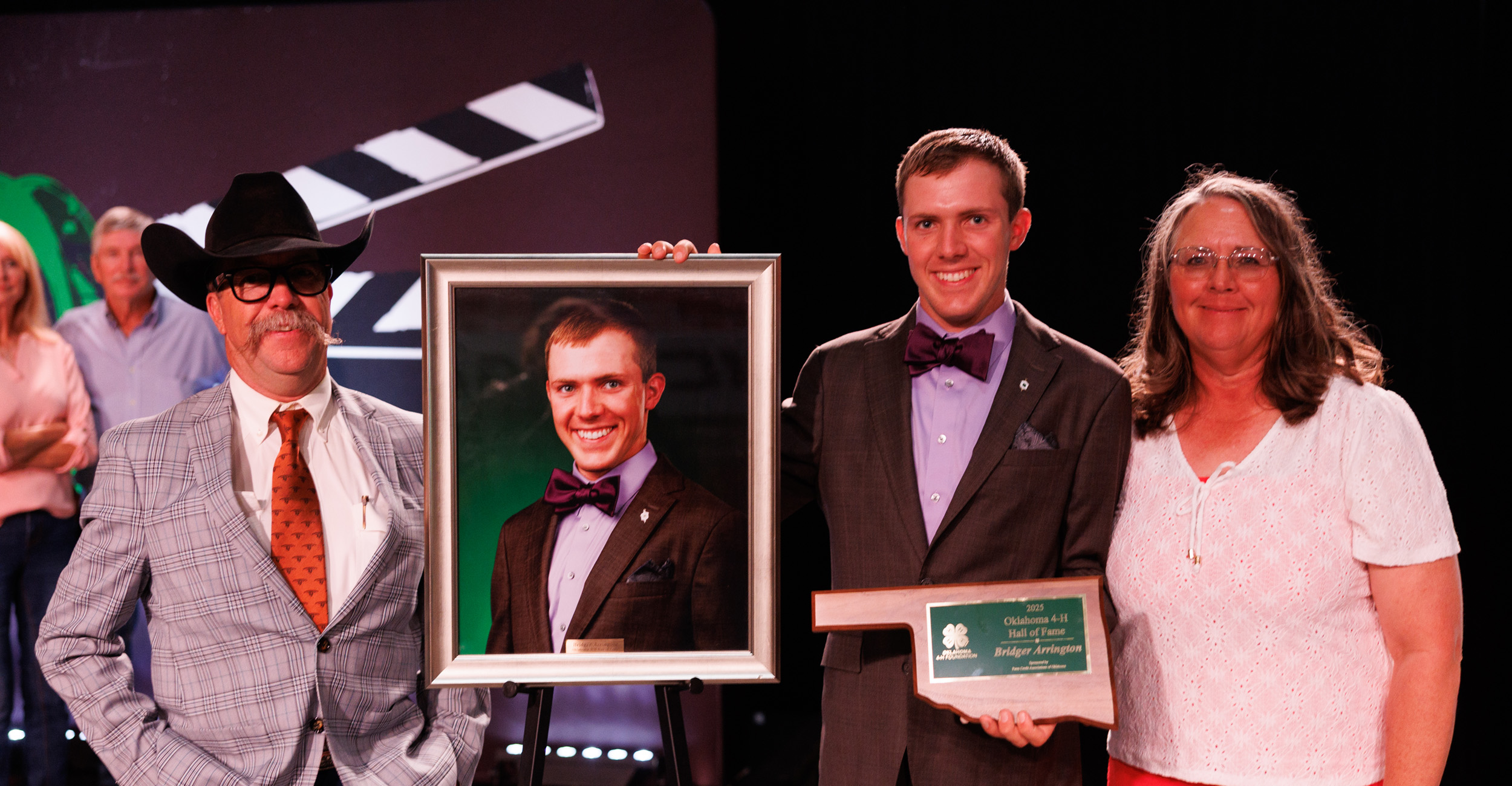 Logan County 4-H’er Bridger Arrington was inducted into the Oklahoma 4-H Hall of Fame during the 104th State 4-H Roundup recently at Oklahoma State University. He is pictured with his parents, Ryan and Kayce Arrington. (Photo by Mitchell Alcala, OSU Agriculture)