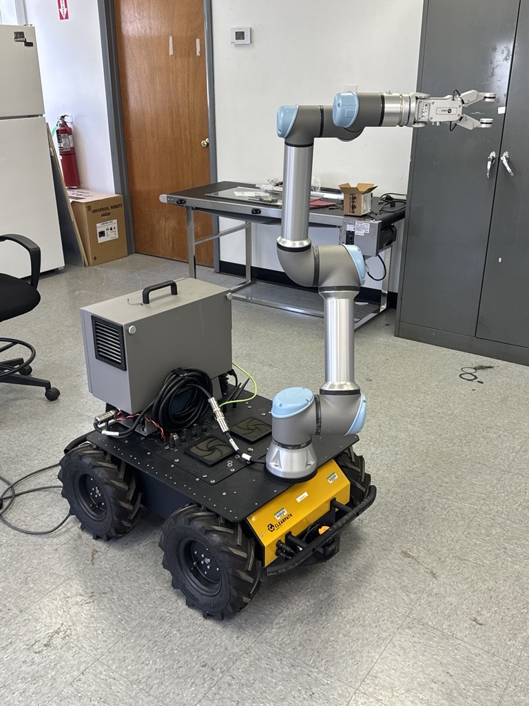 PATHOGEN DETECTIVE — An autonomous robot that takes swabs and analyzes them for pathogens in a poultry processing facility was developed by the Arkansas team of the Center for Scalable and Intelligent Automation in Poultry Processing, a project supported by USDA-NIFA. (U of A System Division of Agriculture photo)
