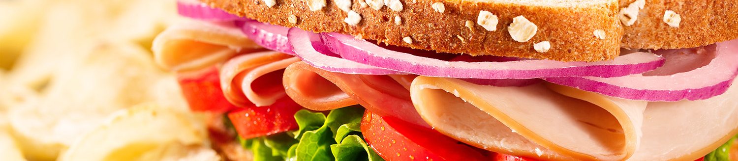 Ham and turkey sandwich with chips. (Adobe Stock │ #150082453 - lindahughes)