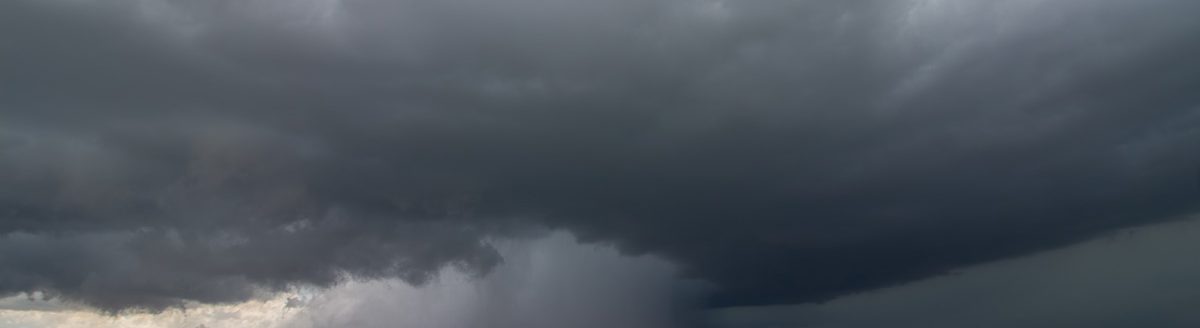 Supercell thunderstorm passes by a dry wheat field, releasing an intense core of rain and hail. (Adobe Stock │ #211841899 - Dan Ross)