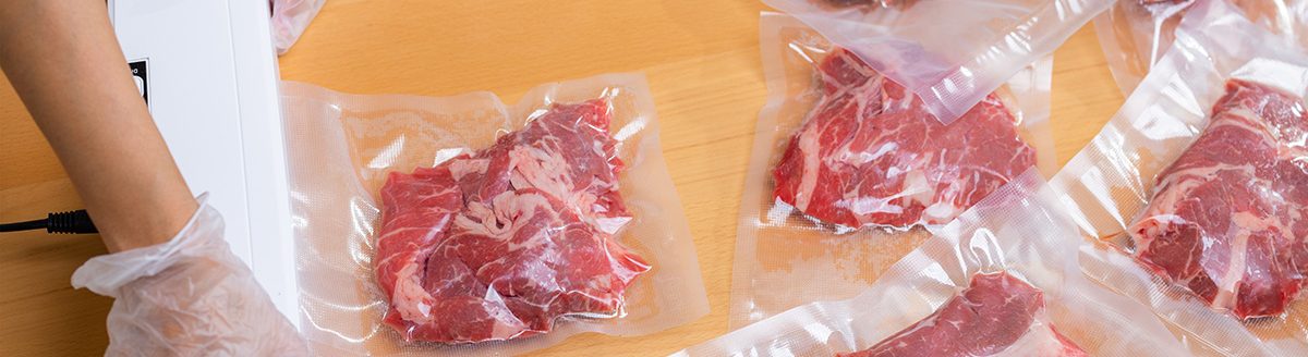 Raw beef meat sealed in plastic shrink wrap with vacuum sealer. (Adobe Stock │ #588428953 - leungchopan)