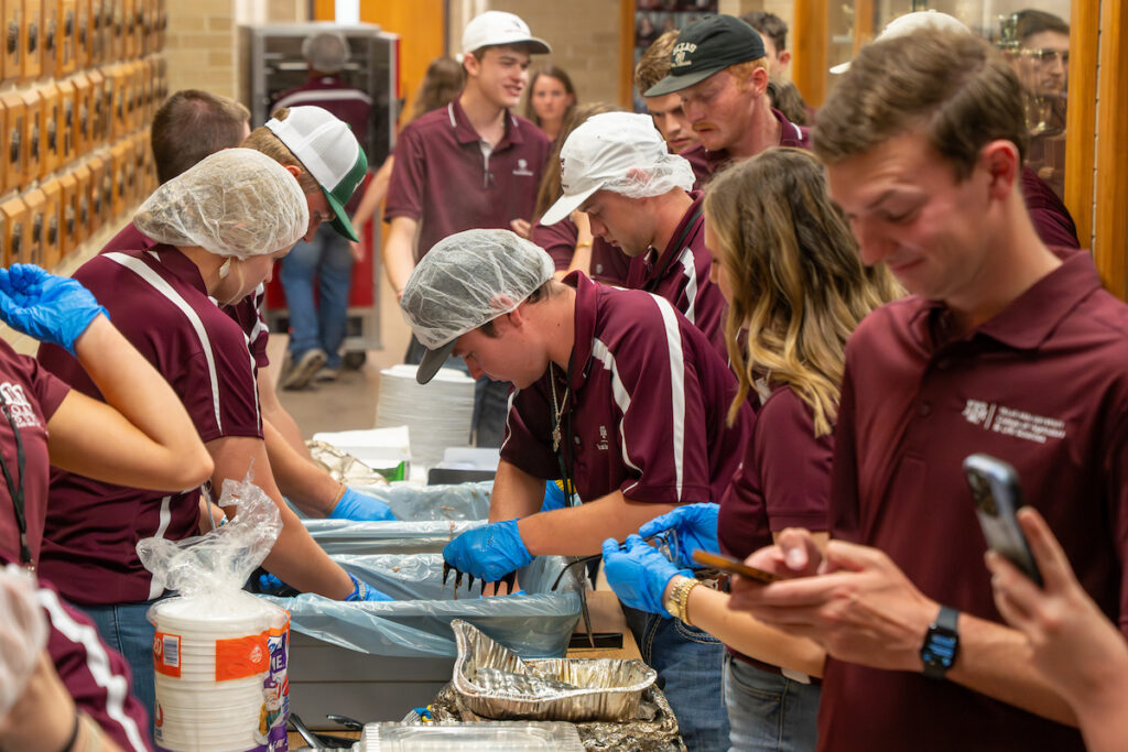 During each class, 75 teaching assistants volunteer their time to make theTexas Barbecue class a College tradition. (Hannah Harrison/Texas A&M AgriLife)