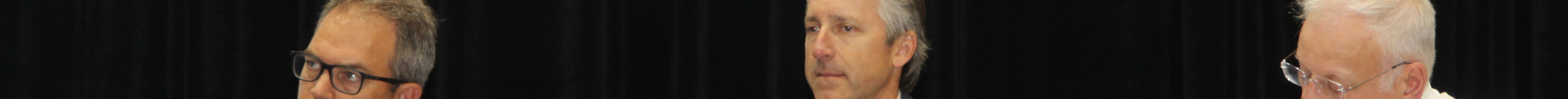 (Not pictured) Moderator Ken Eriksen leads a discussion on grain storage, marketing and shipping with panelists (from left) Mike Steenhoek, Scott Sartor and Guy Allen. (Journal photo by Dave Bergmeier.)