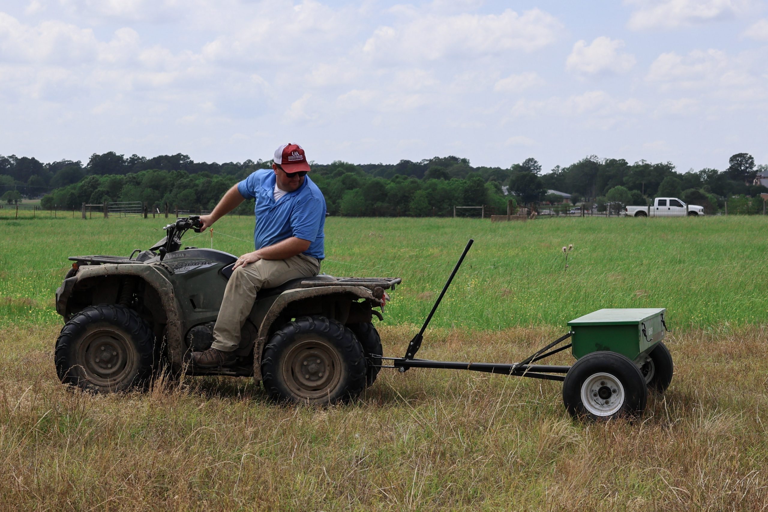 Jonathan Kubesch used an ATV pull-behind broadcast seeder followed by harrowing to increase seed-to-soil contact (U of A System Division of Agriculture photo)