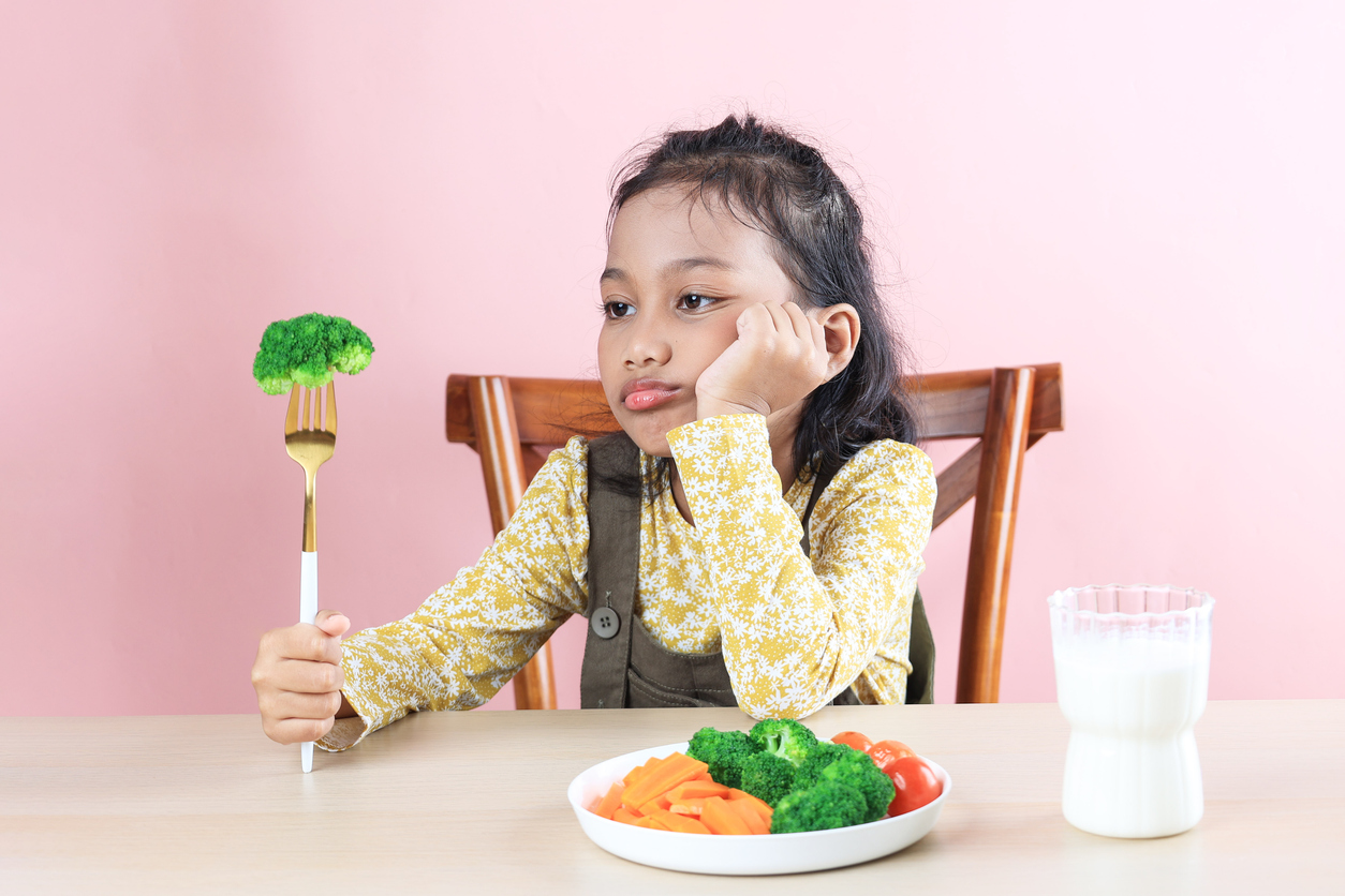 Cute Girl Refuses to Eat Broccoli. Picky Eater. (iStock │ #2149035774 - Ika Rahma)