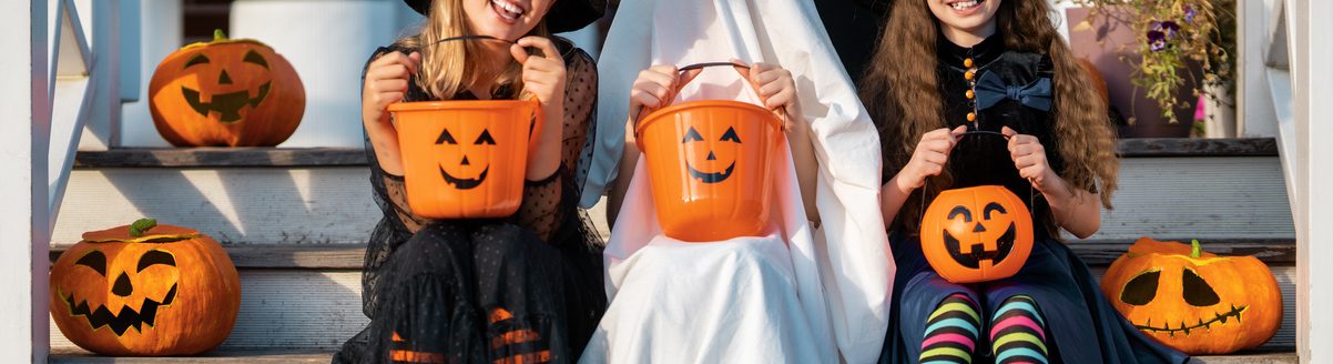 Happy children celebrating Halloween trick-or-treating. (iStock │ #2235668242 - Choreograph)