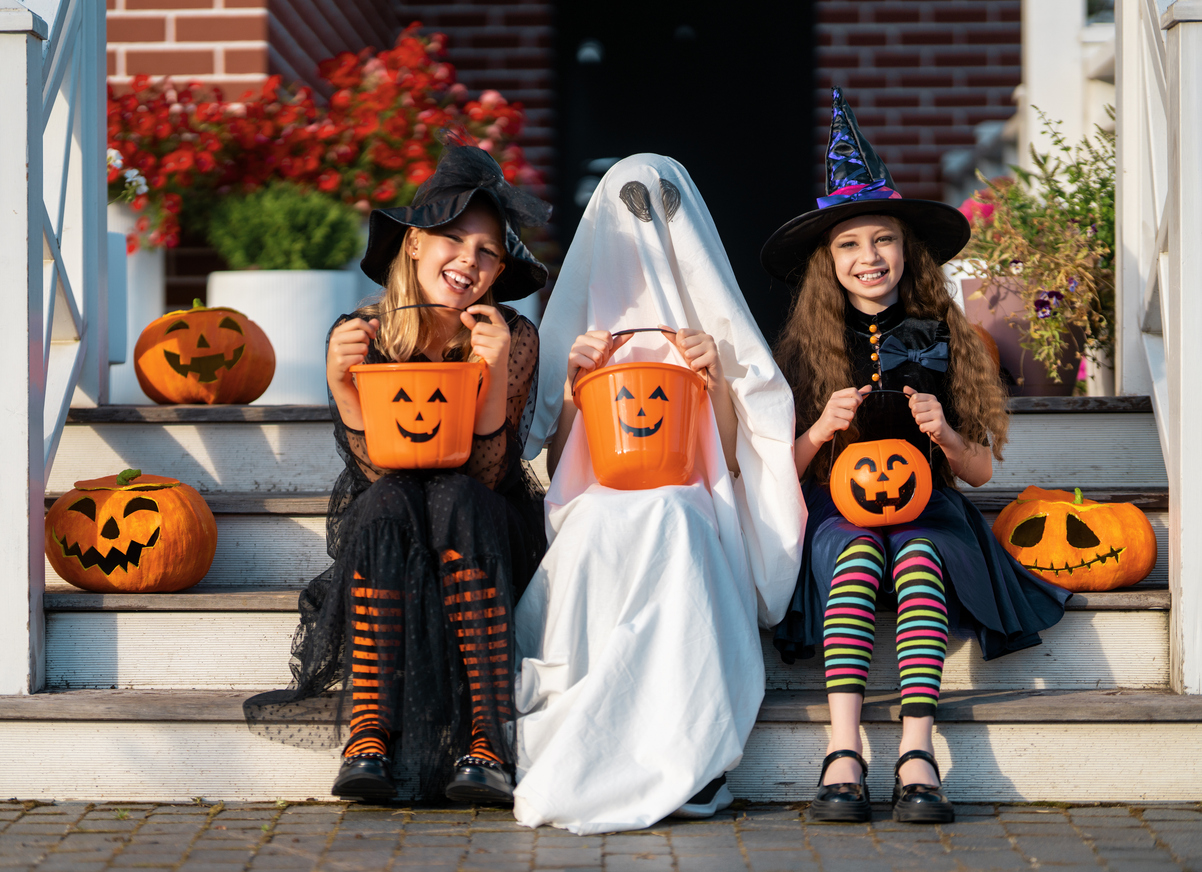 Happy children celebrating Halloween trick-or-treating. (iStock │ #2235668242 - Choreograph)