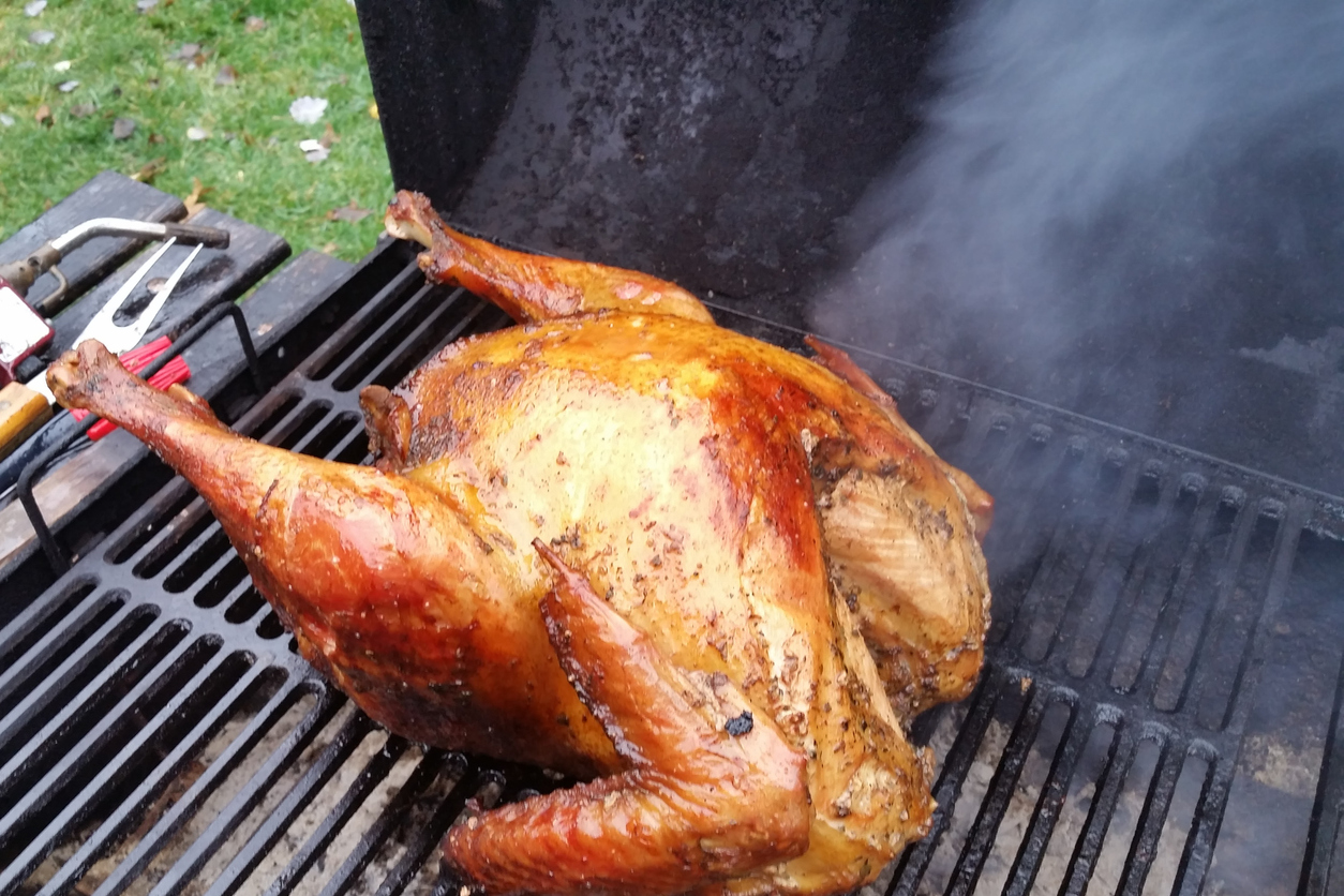Smoked turkey on bbq grill. (iStock │ #1444566014 - Anthony Jackson)