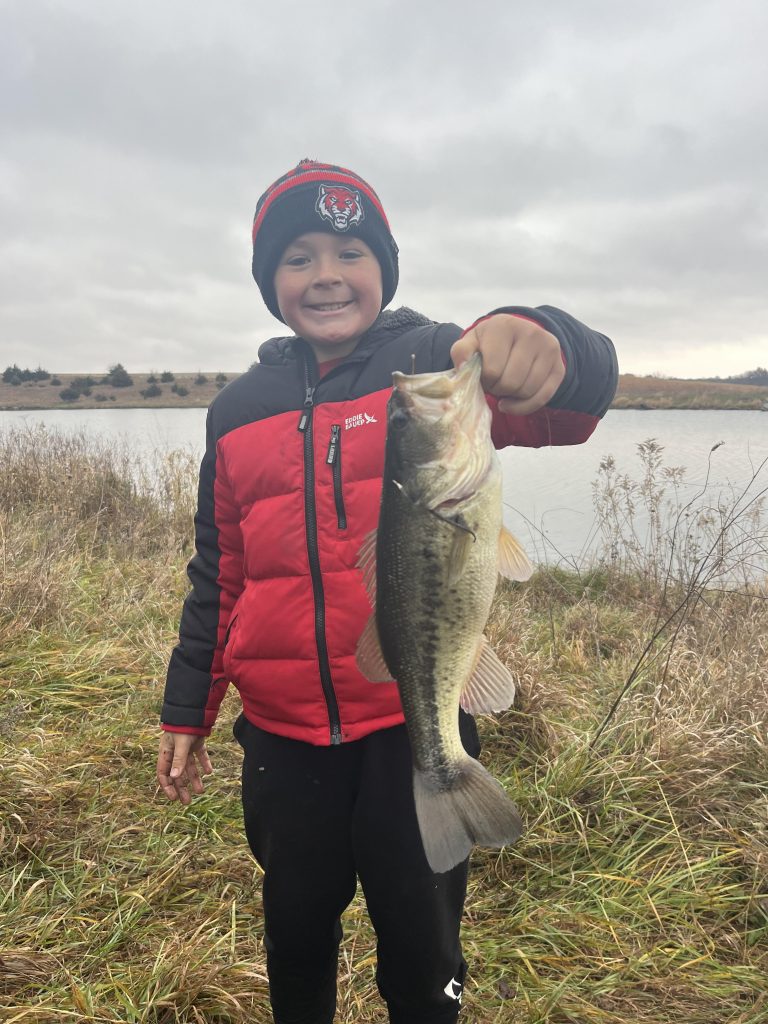 Davin W. of Dallas County shows his memorable 15.5” bass from the fall 2025 bass tournament. (Iowa State University Extension)