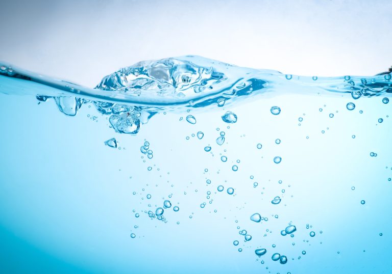 The flow of water creates a splash and the blue waves underwater. (Adobe Stock │ #410296737- VRVIRUS)