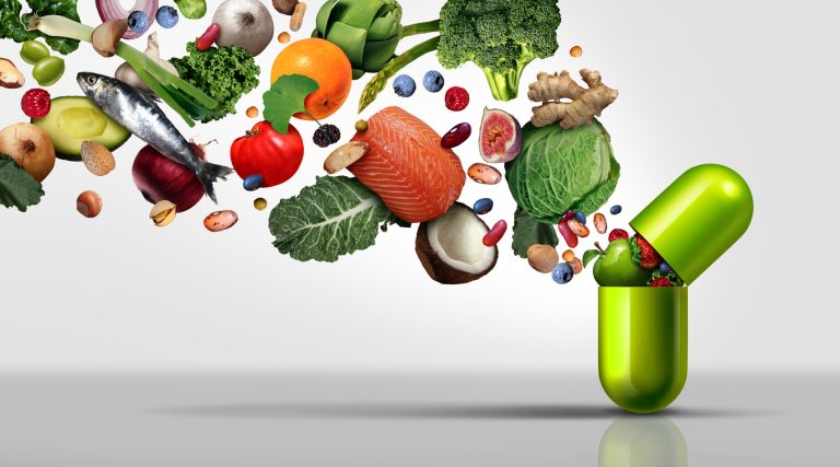 Nutritional supplement and vitamin supplements as a capsule with fruit vegetables nuts and beans inside a nutrient pill as a natural medicine health treatment. (iStock │ #1181042276 - wildpixel)