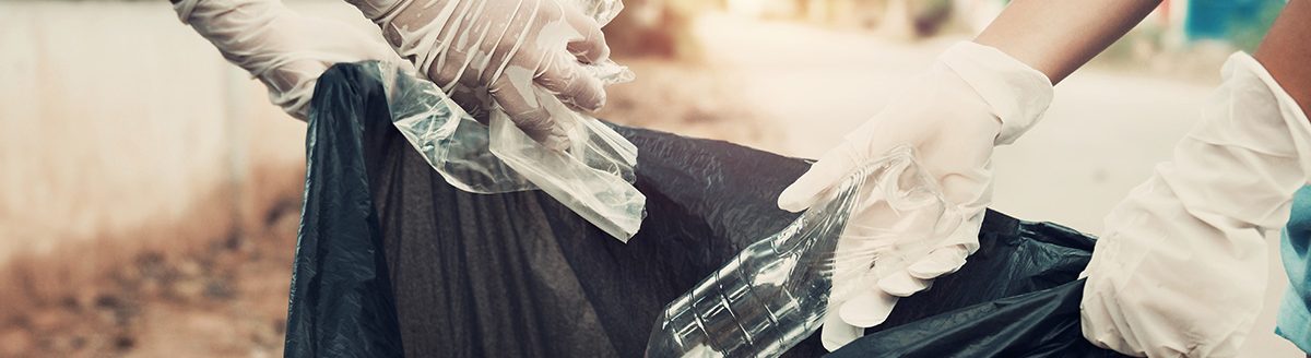 Mother and child help picking up trash at park. (Adobe Stock │ #240623540 - lovelyday12)