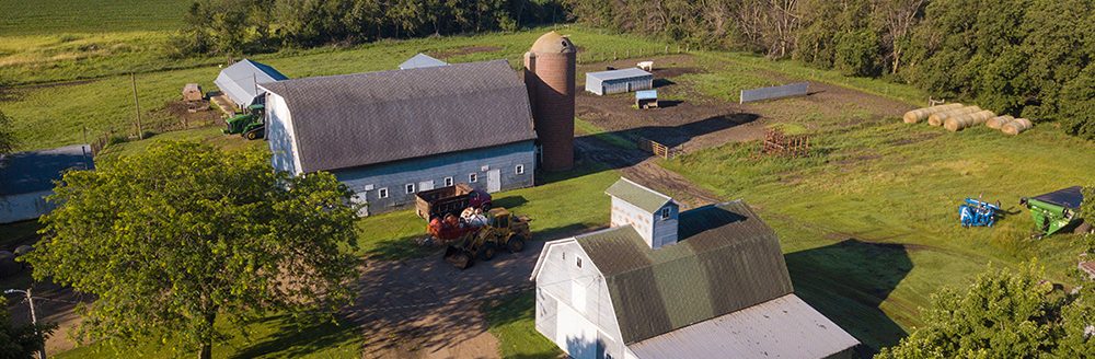 Aerial view of property released farm buildings in South Dakota. (Adobe Stock │ #280402999 - Wollwerth Imagery)