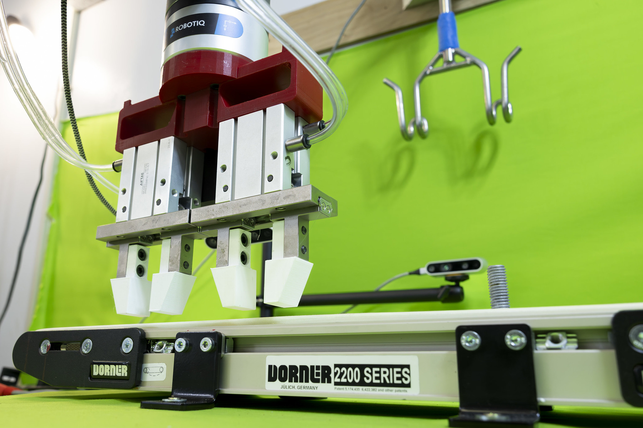 CHICGRASP — The autonomous robotic arm was programmed with imitation learning, trained by a human, to move a chicken carcass onto a shackle conveyor for further processing while adjusting to challenges. (UADA photo)