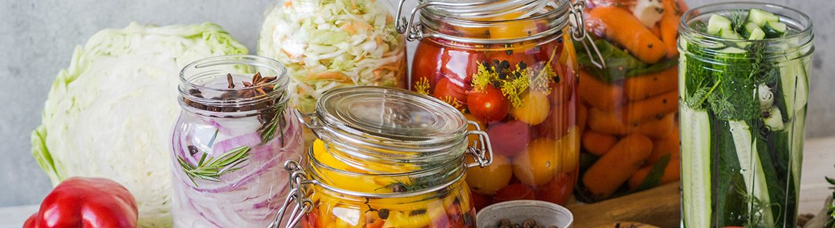 Cooking pickled vegetables. Salting various vegetables in glass jars for long-term storage. (Adobe Stock │ #275525226- senteliaolga)