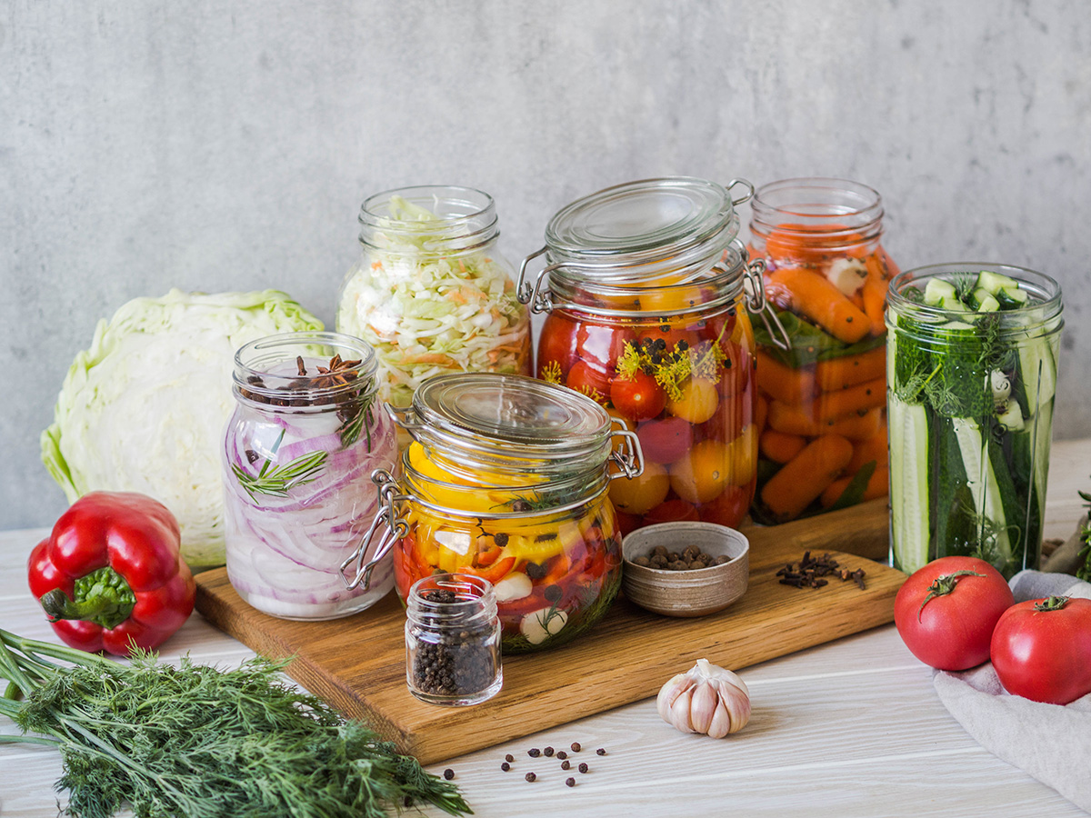 Cooking pickled vegetables. Salting various vegetables in glass jars for long-term storage. (Adobe Stock │ #275525226- senteliaolga)