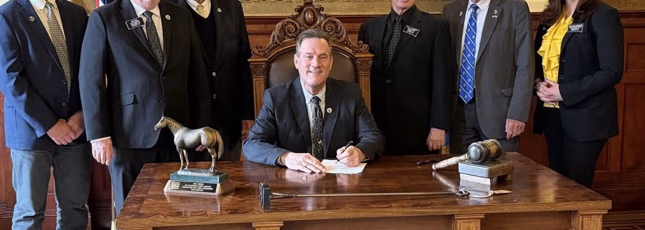 South Dakota State University officials and state lawmakers look on as South Dakota Gov. Larry Rhoden signs a bill Tuesday authorizing the expansion of the SDSU Swine Education and Research Facility. From left are Distinguished Professor and SDSU Extension Swine Specialist Bob Thaler, District 7 Rep. Tim Reed, SDSU President Barry Dunn, Rhoden, District 20 Rep. Paul Miskimins, District 13 Rep. Jack Kolbeck and District 7 Rep. Mellissa Heermann. (South Dakota State University)
