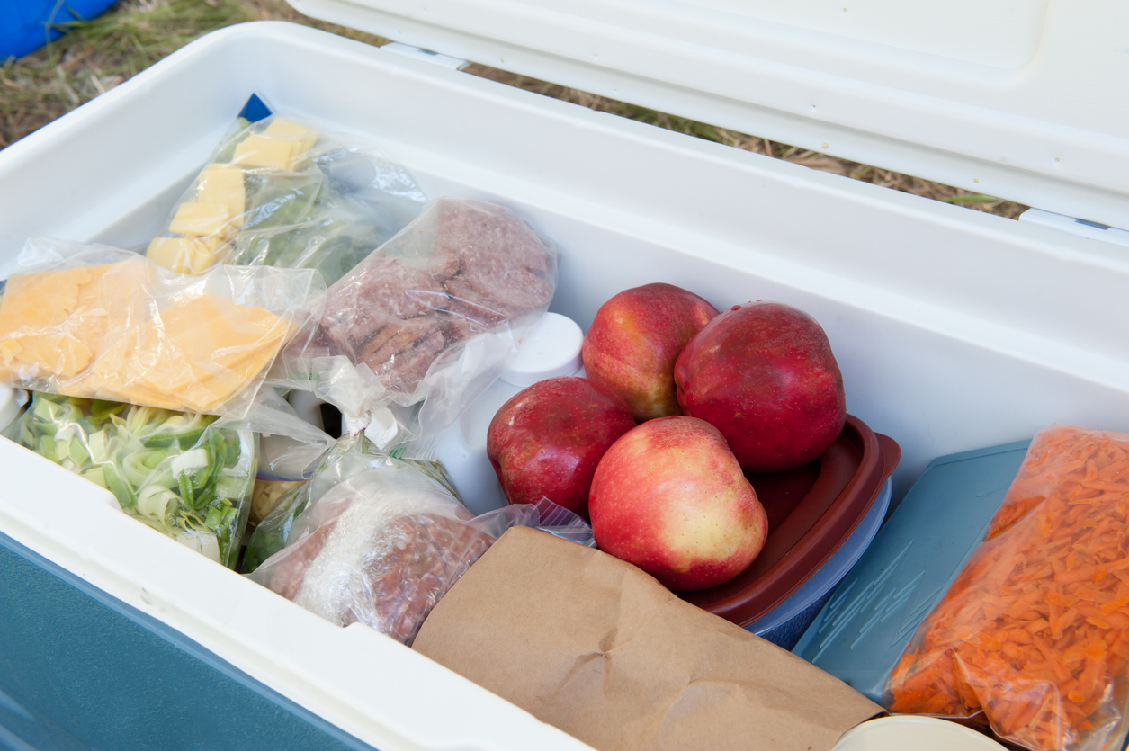 Cooler filled with food for a camping trip. (iStock-#150875029 │ fishysam)