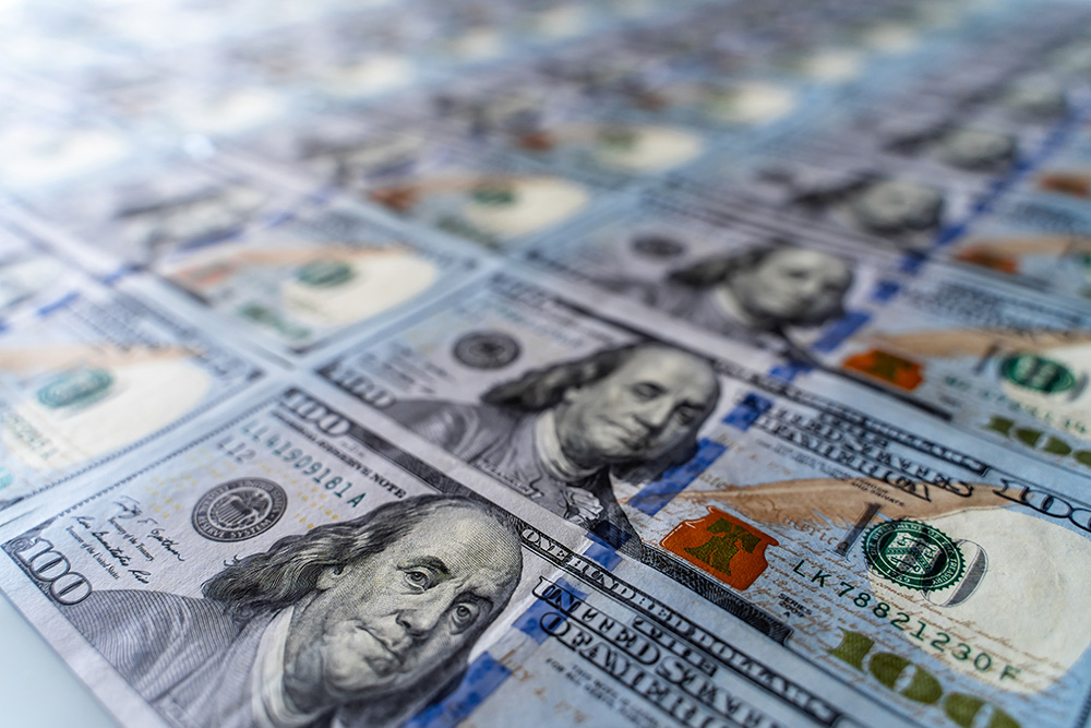 One hundred dollar bills. (Adobe Stock-#348572780 │ Vadim)