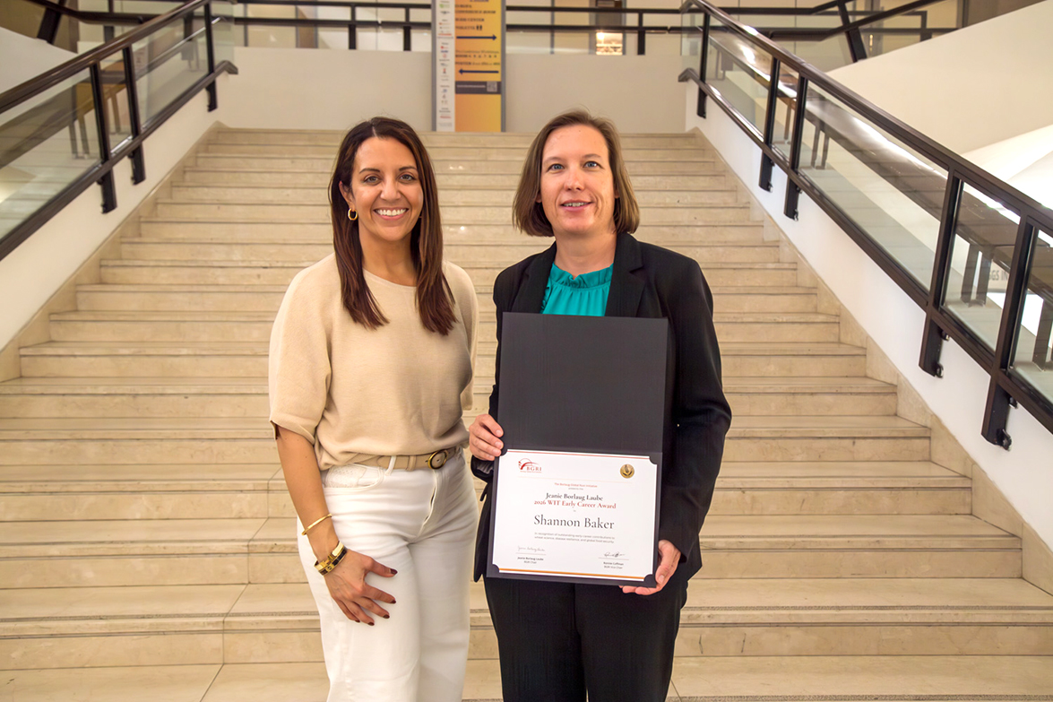Shannon Baker, Ph.D., Texas A&M AgriLife Research assistant research scientist in Canyon, was presented the 2026 Jeanie Borlaug Laube Women in Triticum Early Career Award by Maricelis Acevedo, Ph.D., director of science for the Borlaug Global Rust Initiative. (Matt Hayes/Cornell University)