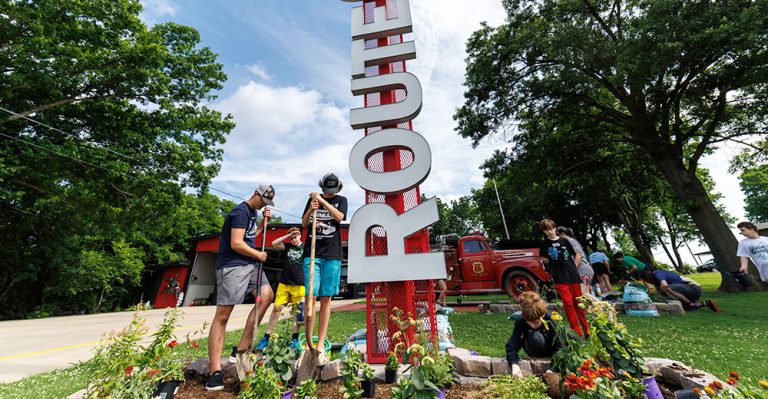 Tulsa County 4-H’ers install pollinator flower beds at Tulsa Fire Station 66 along historic Route 66 on June 4. (Photo by Mitchell Alcala, OSU Agriculture)