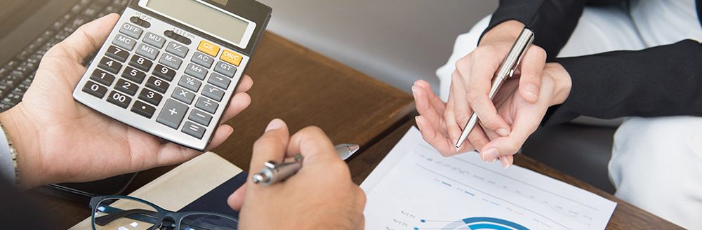 Business people calculating and discussing financial documents. (Adobe Stock-#126893597 │ Atstock Productions)