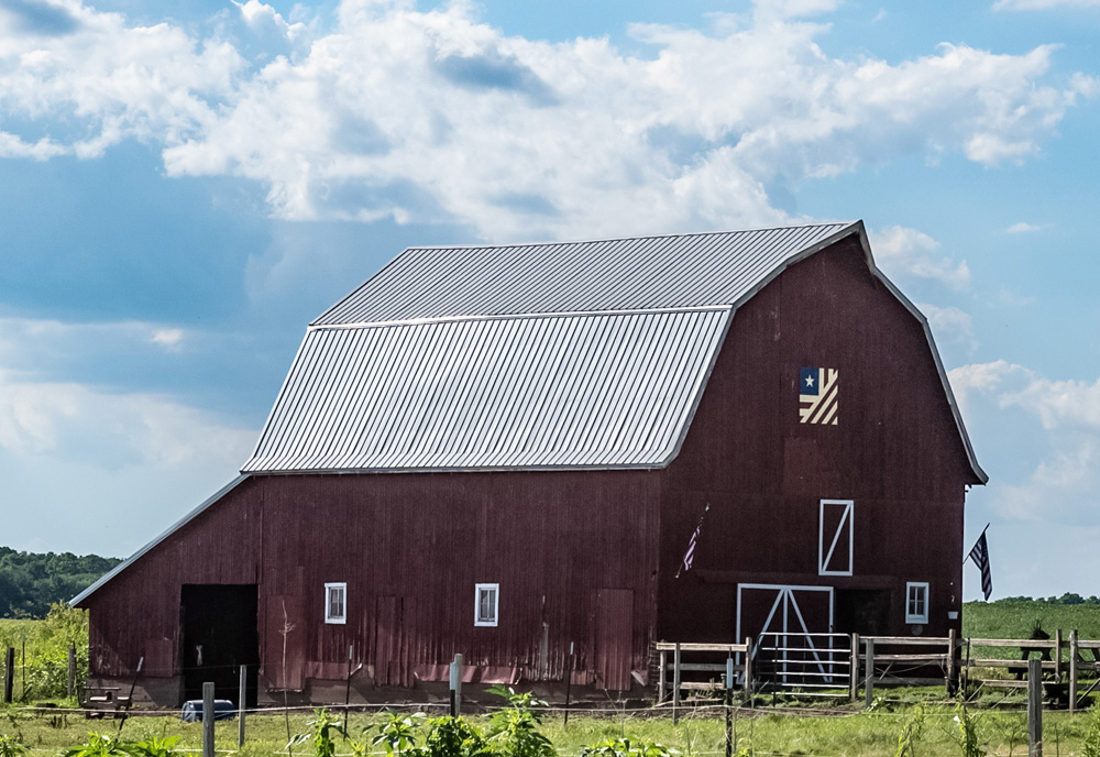 Vertical barn quilt country landscape. (Adobe Stock-#214496294 │ jackienix)