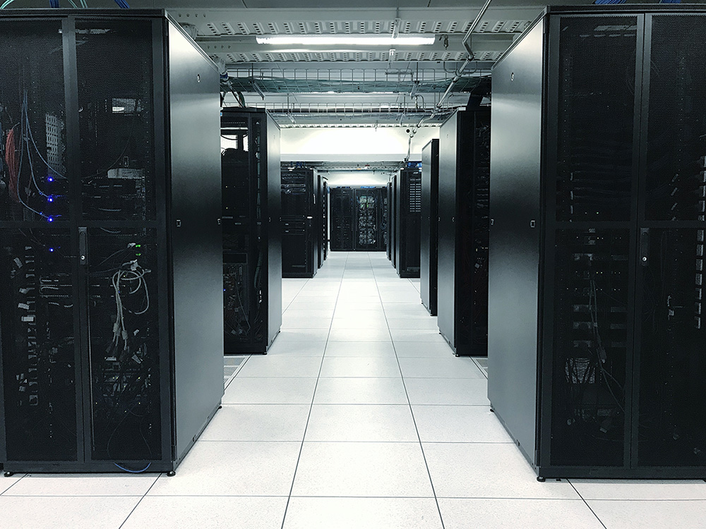 Row of server racks or network device racks in data center. (Adobe Stock-#224325077 │ elbanco)