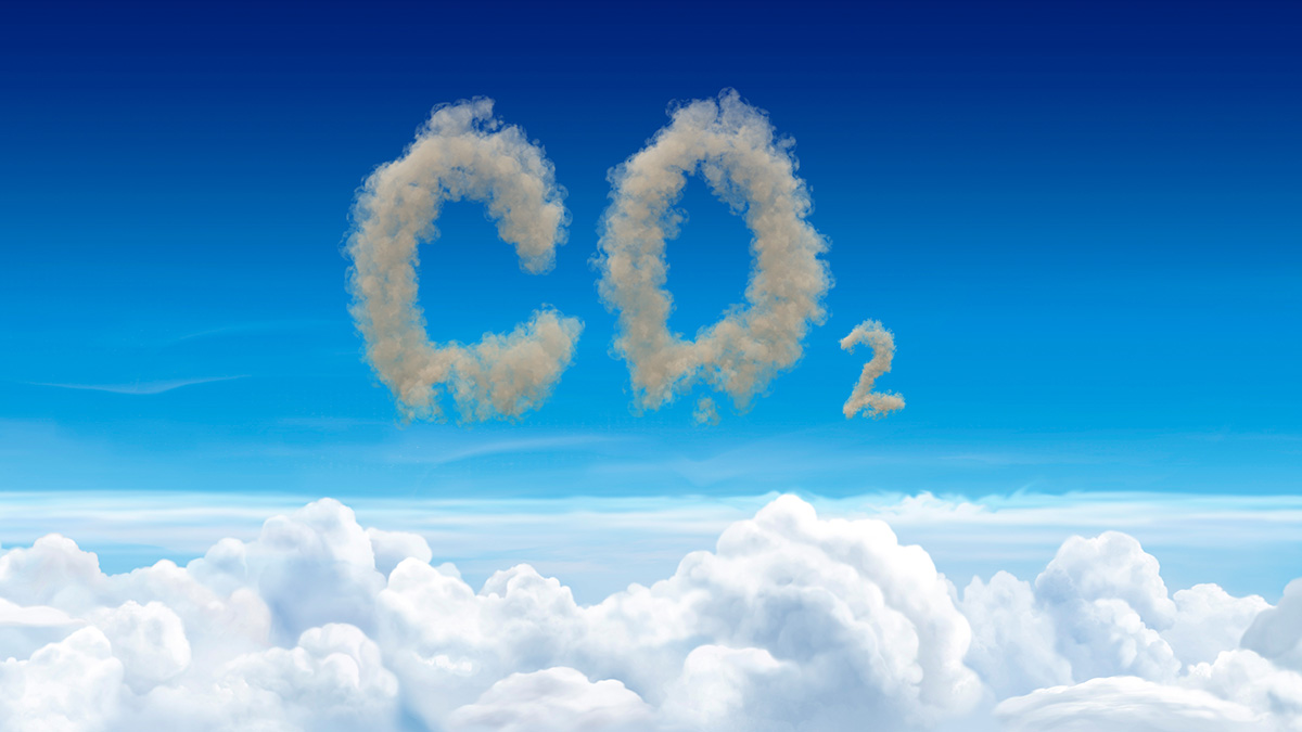CO2 atmospheric pollution concept with dirty brown clouds spelling CO2 above a layer of pristine white clouds in a blue sky. (Adobe Stock-#274848147 │ fotogestoeber)
