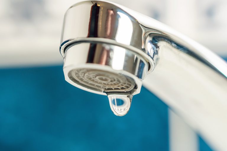 A drop of water drips from a leaky faucet. (Adobe Stock-#705247039 │ andrei310)