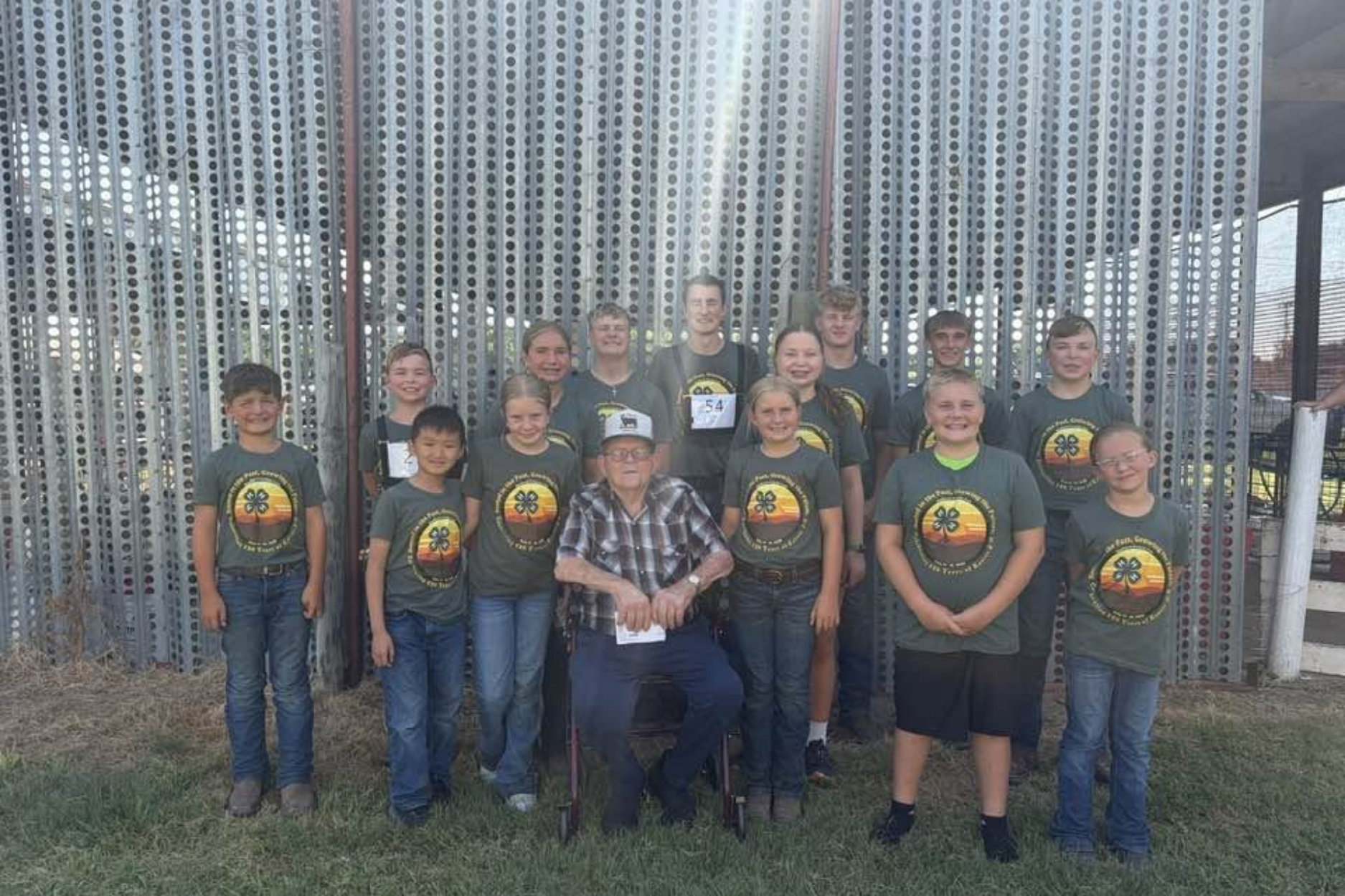 Marion Alpers surrounded by 14 of his great-grandchildren — all of whom have participated in the Jolly Workers 4-H club. (Courtesy photo.)