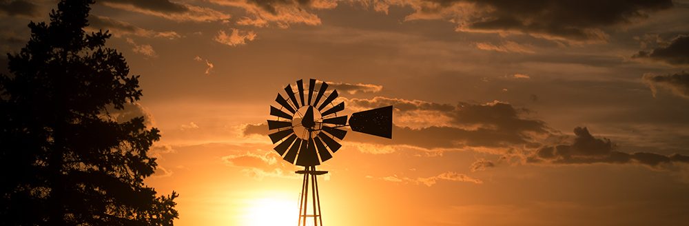Windmill at sunset. (Adobe Stock-#298954324 │ sjredwin1)
