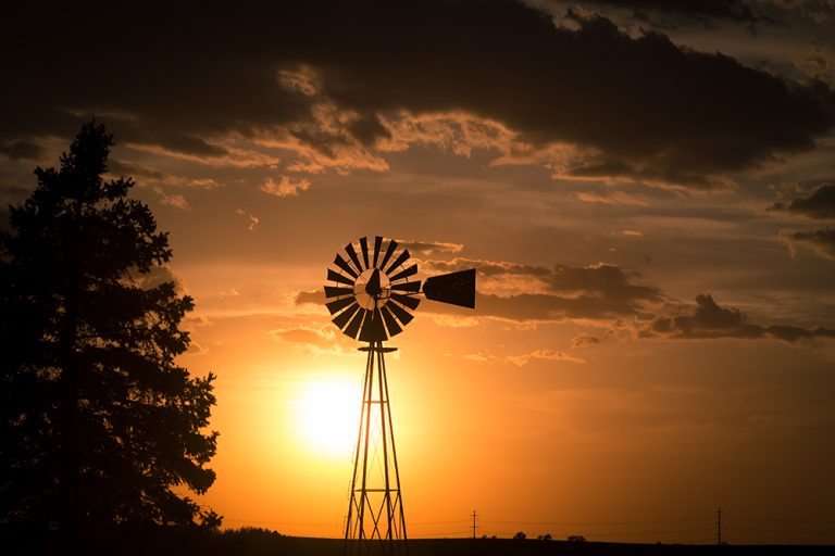 Windmill at sunset. (Adobe Stock-#298954324 │ sjredwin1)