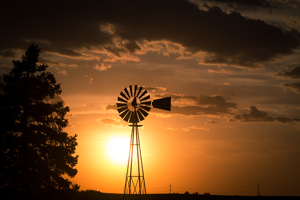 Windmill at sunset. (Adobe Stock-#298954324 │ sjredwin1)