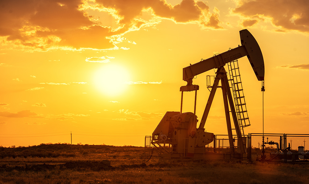 Oil pump oil rig energy industrial machine for petroleum in the sunset background. (Adobe Stock-#315838943 │ Sasint)