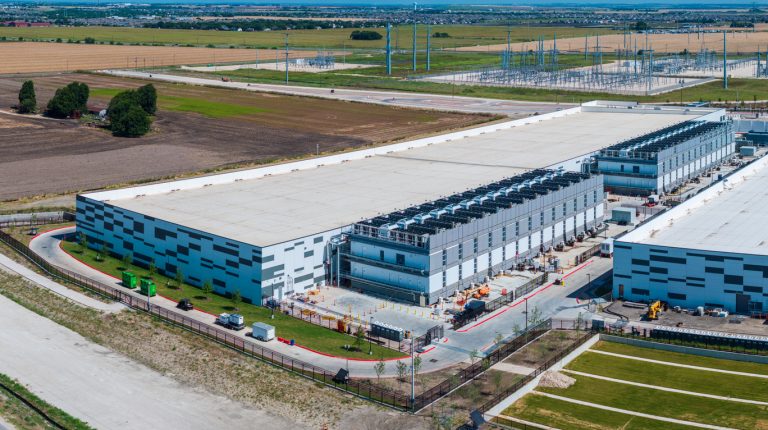 Aerial view of a large data center campus with focus on the processor hosting area and power and cooling infrastructure being built in Hutto, Texas. (iStock-#2284670826 │ BackyardProduction)