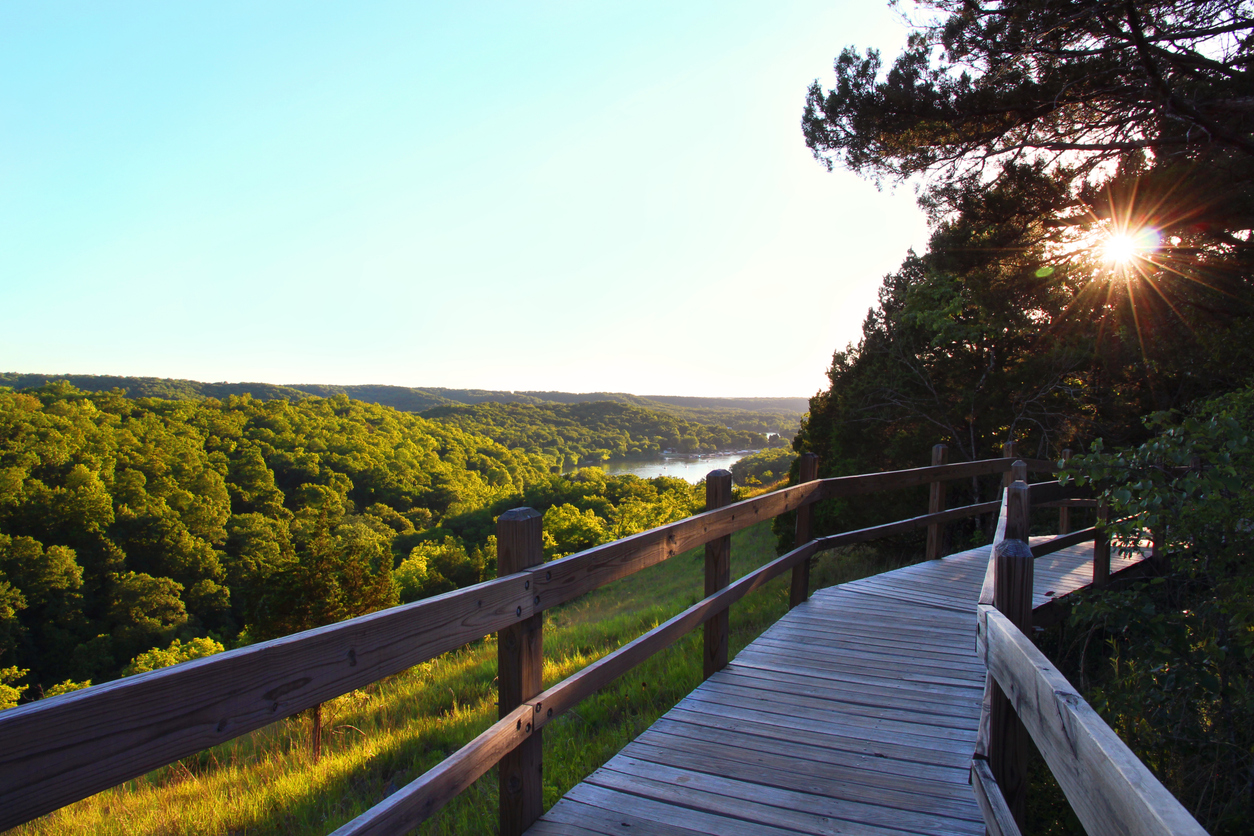 Walking along the boardwalk towards the castle at Ha Ha Tonka State Park as sunset approaches. (iStock-#810426944 │ Eifel Kreutz)