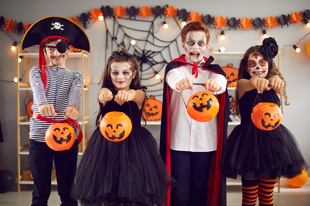 Kids are ready for tricks or treats on Halloween night. (Adobe Stock-#458261994 │ Studio Romantic)