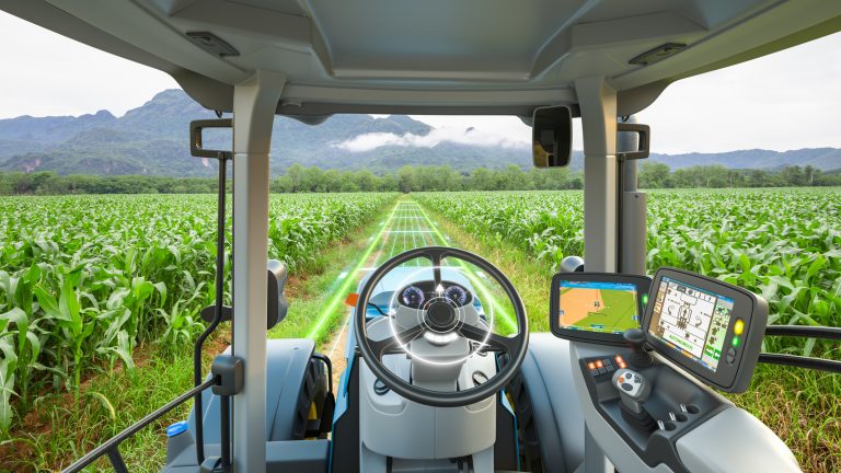 5G autonomous tractor working in corn field, Future technology with smart agriculture farming concept. (Photo courtesy ISTOCK. Credit Kinwun.)